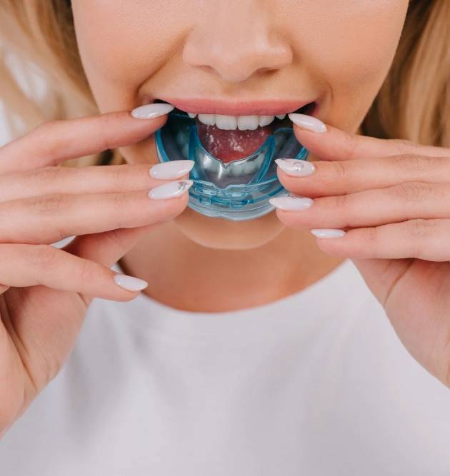Woman is wearing her mouth guard in Oklahoma City, OK