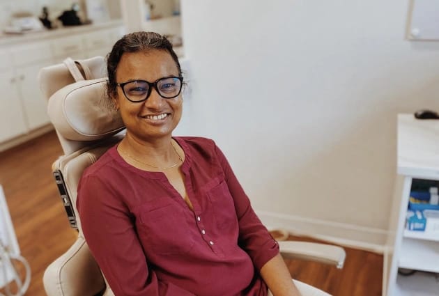 Smiling woman after dental checkup at Warwick Dental, Oklahoma City